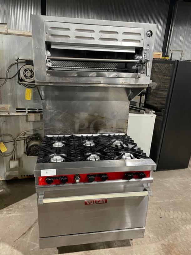 Vulcan commercial stainless steel 6-burner range/oven combo with overhead salamander broiler, backsplash, and wired rack.