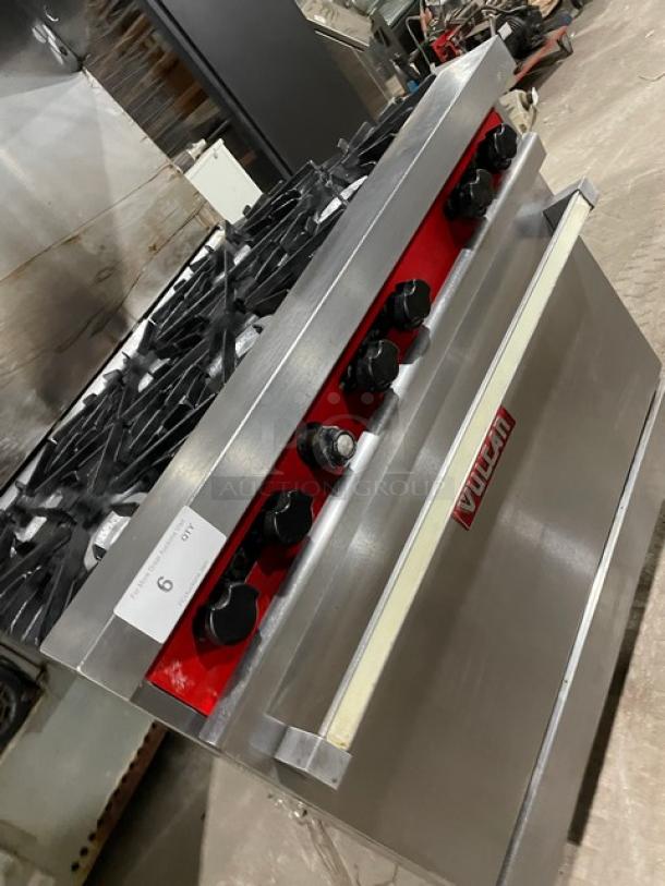 Vulcan stainless steel 6-burner range/oven combo, natural gas, with backsplash, overhead salamander, and wired oven rack, on legs.