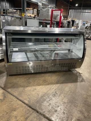Alamo XDC200 stainless steel deli display with curved glass, poly-coated rack, and rear sliding glass doors. Model SN: 6606315117010512, 110V.