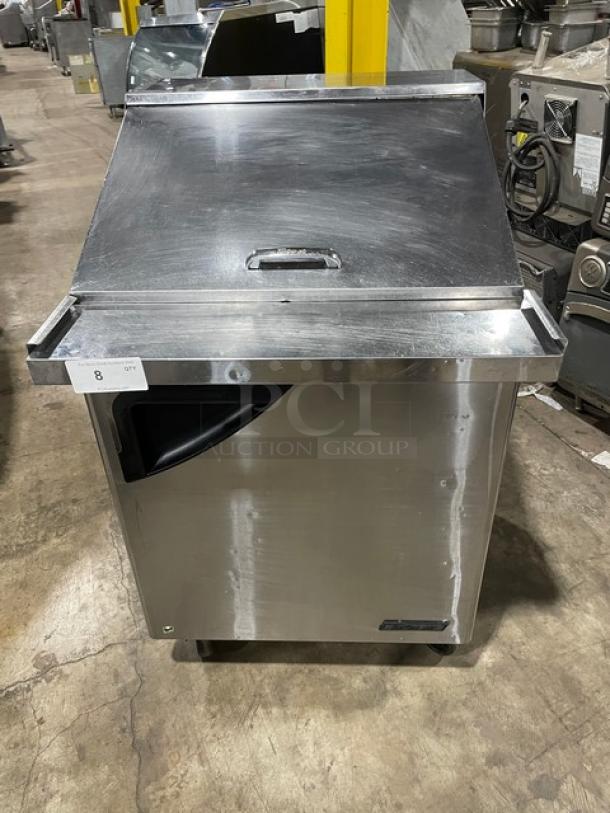 Turbo Air Super Deluxe stainless steel refrigerated prep table, model TST-28SD-12, features solid door and caster wheels.