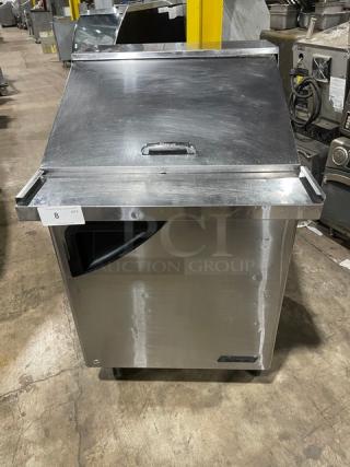 Turbo Air Super Deluxe stainless steel refrigerated prep table, model TST-28SD-12, features solid door and caster wheels.