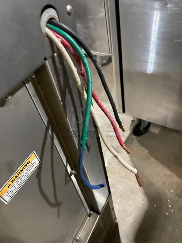 Hobart LX30H commercial dishwasher, stainless steel, undercounter model. Shows exposed wiring and warning label.