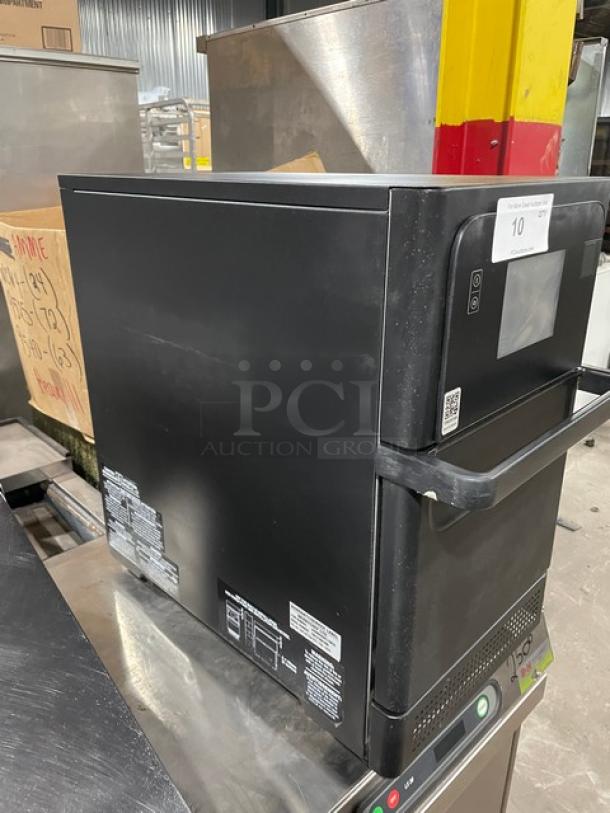 MerryChef Eikon E2S black countertop rapid cook oven, electric, model EikonE2S, SN: 2301213091000, 208/240V, on legs.