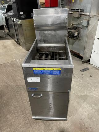 Pitco stainless steel natural gas deep fryer with backsplash, basket hanger, and casters. Features caution labels.