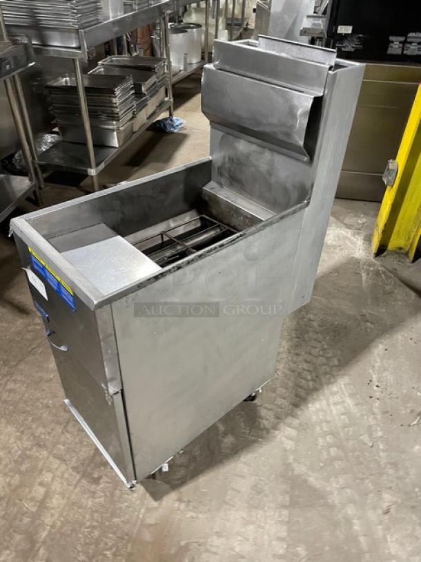 Pitco stainless steel natural gas deep fat fryer with backsplash, basket hanger, and casters. Excellent condition.