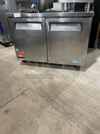 Turbo Air M3 Series stainless steel 2-door undercounter freezer, Model MUF48, on casters, Energy Star certified, with rack.