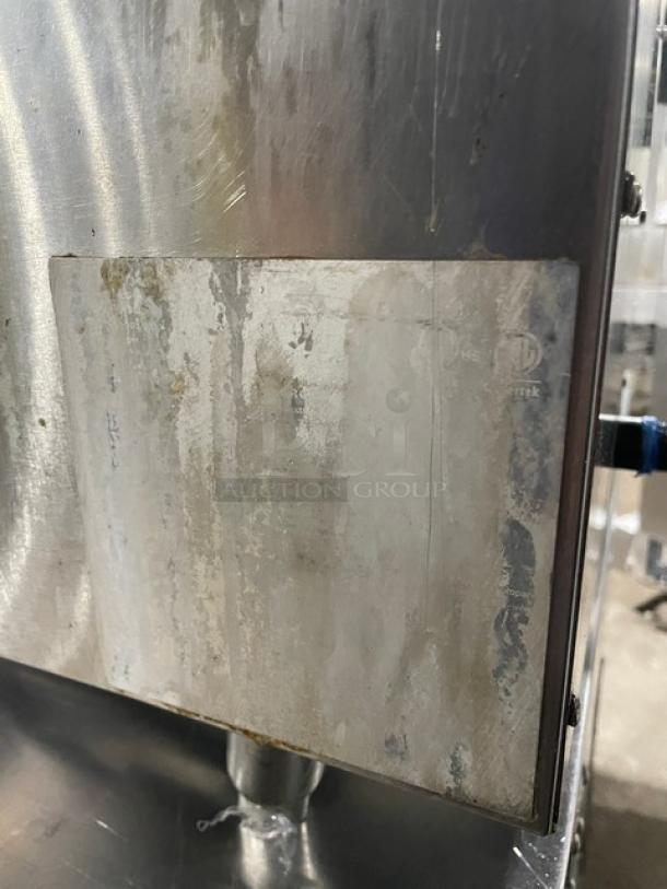 CPG stainless steel natural gas countertop deep fryer; includes backsplash, basket hanger, fry basket, and legs. Visible wear.