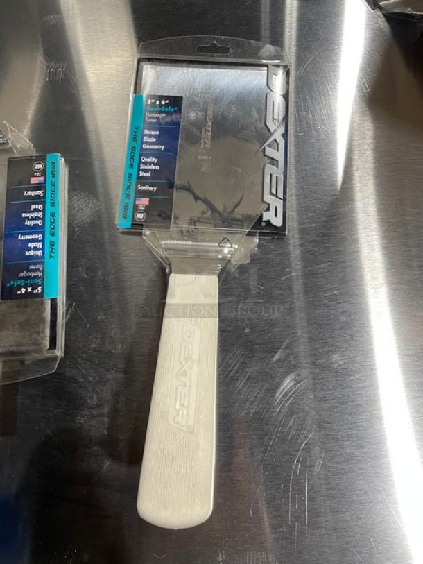 Dexter Russell Sani-Safe hamburger turner, model S285-4, stainless steel 5"x4" blade, white grip handle, new in packaging.