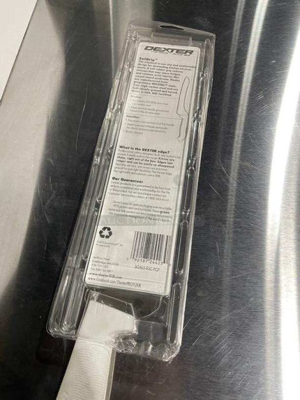 Brand new Dexter Russell SofGrip 9" scalloped offset sandwich knife, model SG163-9SC, in packaging with white grip handle.