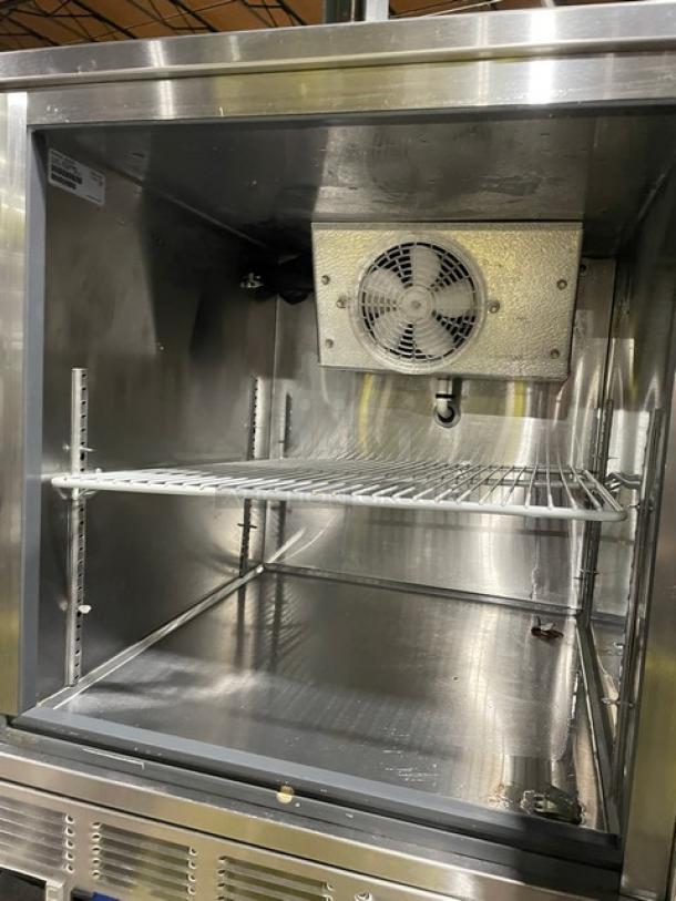 Follett REF5 medical-grade stainless steel undercounter refrigerator, single door, with poly coated wired rack, SN: E15946-28513.