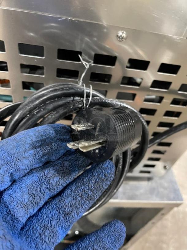 Follett REF5 stainless steel undercounter refrigerator plug, showcasing a poly coated wired rack. Model: REF5, 115V, 1 Phase.