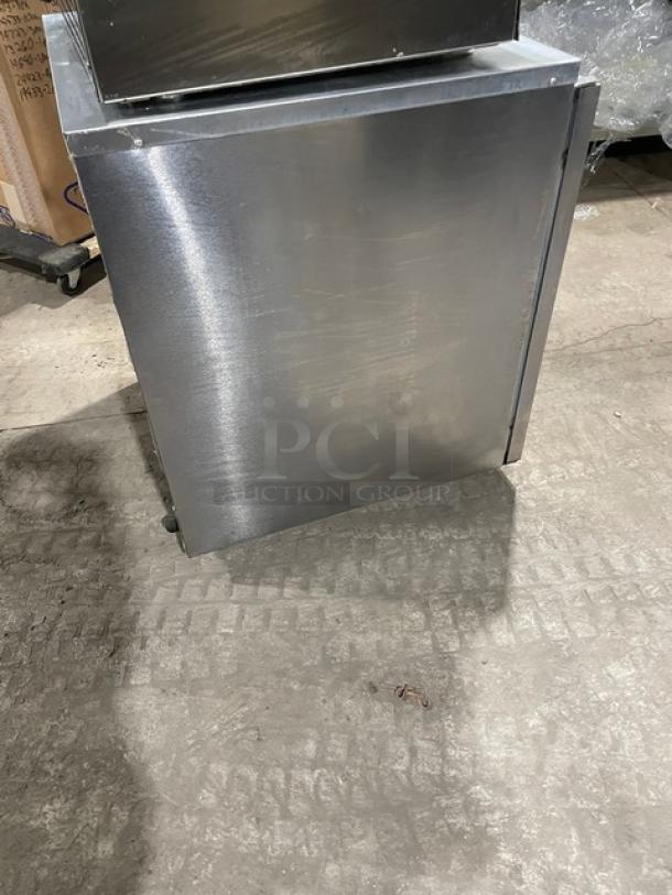 Delfield stainless steel single door undercounter refrigerator, Model 406CA-DHL-DD1, Energy Star certified, on casters.