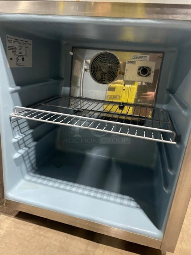 Delfield commercial stainless steel undercounter refrigerator, model 406CADHLDD1, with poly coated rack, Energy Star certified, on casters.