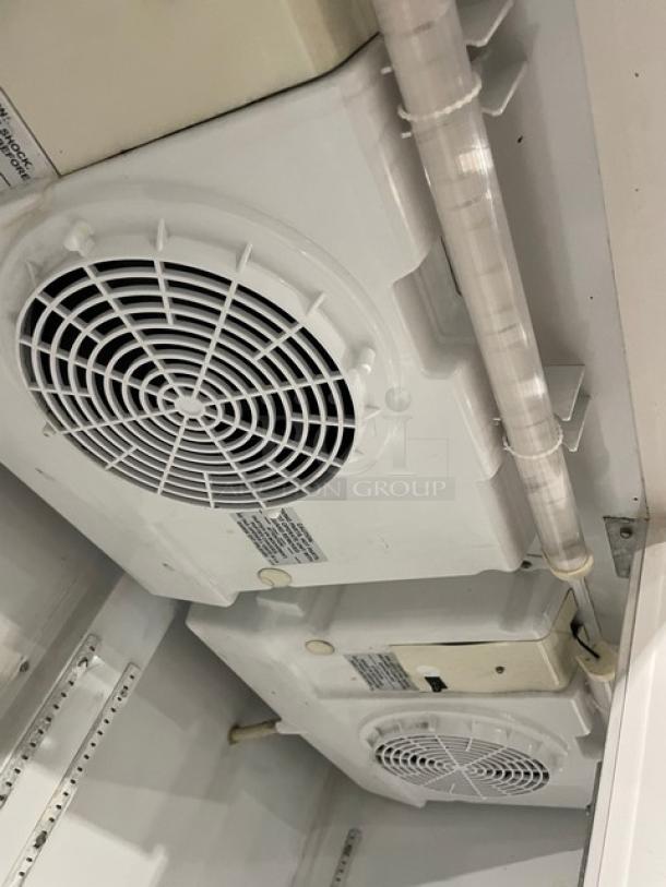 Imbera VRD43 commercial refrigerator interior showing cooling fans and poly coated wired rack details, Energy Star certified.
