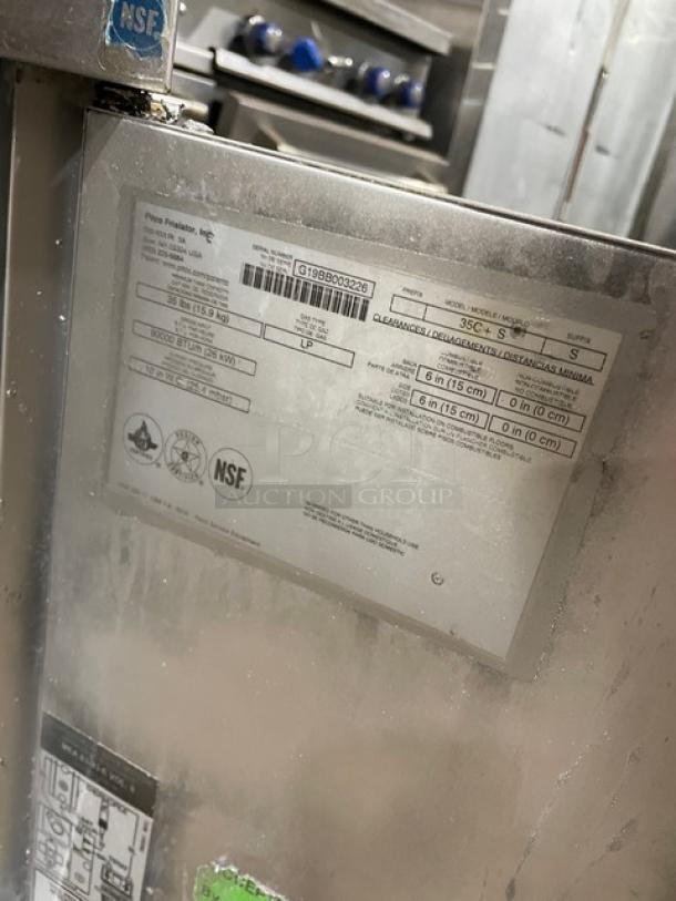 Pitco 35C+S Commercial Deep Fryer, stainless steel, liquid propane, 35 lb. capacity, with backsplash and fry baskets, on legs, NSF certified, serial number G19BB003226.