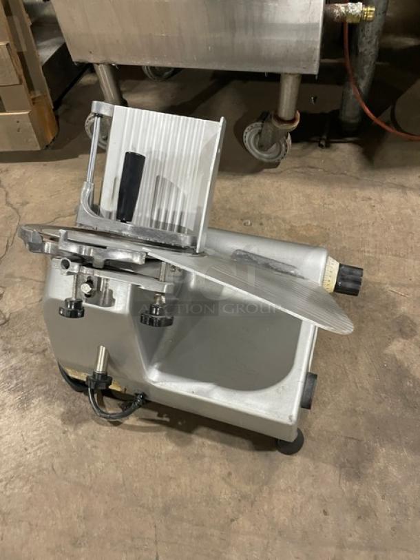 Commercial Electric Semi-Automatic Deli Meat Slicer, Model 26MSC001, 110V, on legs, silver, good condition.