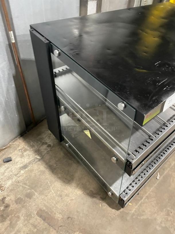 ServIt electric 2-tier heated display case, model 423OAM138D, with slanted glass, 48" wide, for countertop use, 120V.