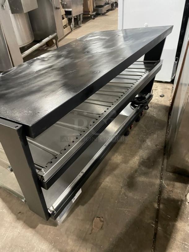ServIt 423OAM138D Commercial 48" Slanted Heated Display Case. Two-tier, open-air, countertop. Black exterior, good condition.