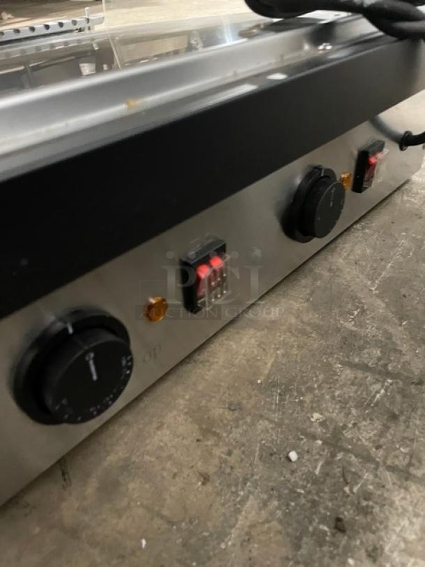 ServIt countertop slanted 48" 2-tier heated merchandiser display, Model 423OAM138D. Features control knobs, 120V.