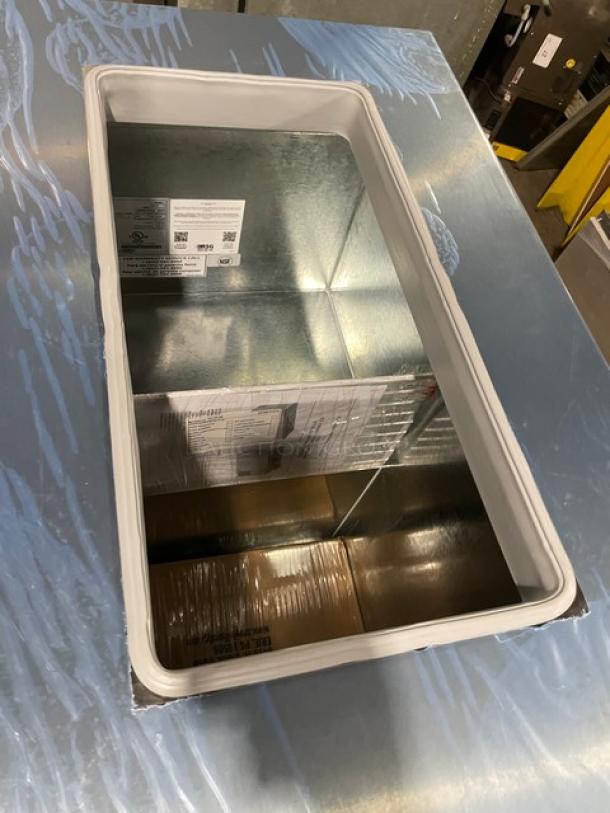 Master-Bilt DC2S commercial ice cream dipping cabinet with flip lid, 32" wide, new condition, model and serial number tags visible.