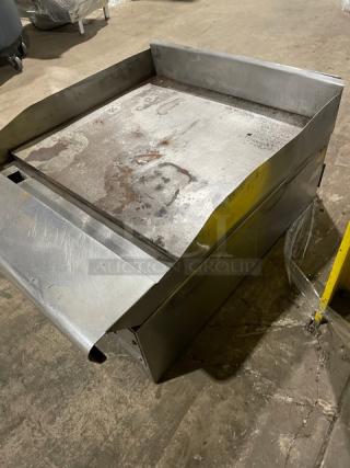 American Range stainless steel flat griddle with back and side splash, used condition, countertop model, natural gas powered.