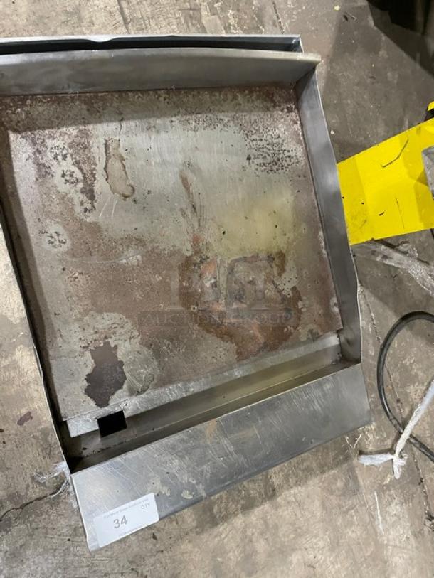 American Range stainless steel countertop flat griddle with back and side splash, natural gas powered, signs of use.