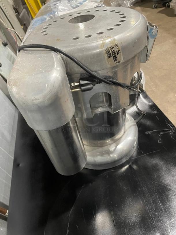L&J WF-A2000 electric stainless steel juice extractor, 110V, commercial grade, good condition, visible power cord.