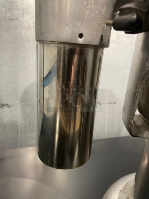 L&J Commercial Stainless Steel Electric Juice Extractor, Model WF-A2000. Visible sturdy construction, good condition.