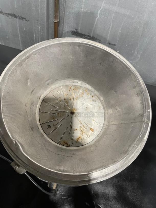 L&J WF-A2000 stainless steel juice extractor, electric-powered, used condition, visible wear inside, 110V countertop model.