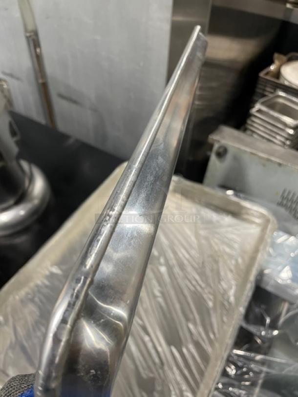 Winco commercial aluminum 2/3-size sheet pan, model ALXP1622, new condition, visible clean surface, auction item.