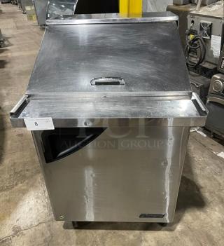Turbo Air Super Deluxe stainless steel refrigerated prep table, model TST-28SD-12, features solid door and caster wheels.
