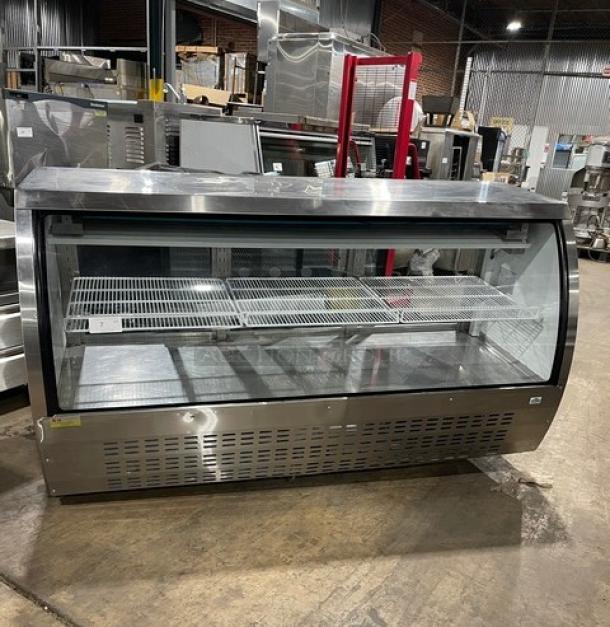 Alamo XDC200 stainless steel deli display with curved glass, poly-coated rack, and rear sliding glass doors. Model SN: 6606315117010512, 110V.