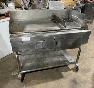 WoodStone commercial stainless steel gas flat griddle with back and side splash, single undershelf cart, on casters.