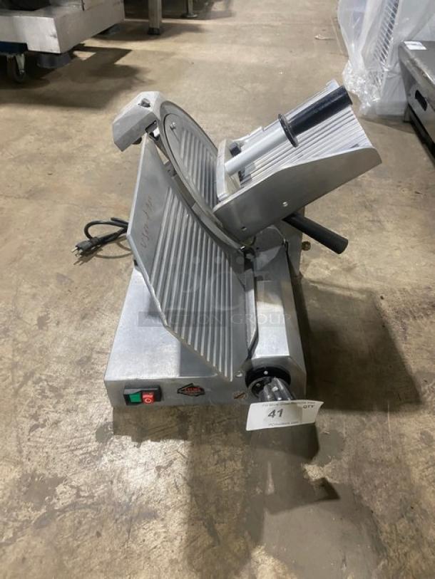 Celme electric countertop deli meat slicer, commercial-grade, metallic finish, visible power cord, in good condition.