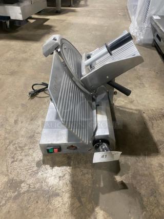 Celme electric countertop deli meat slicer, commercial-grade, metallic finish, visible power cord, in good condition.