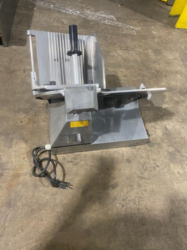 Celme commercial electric countertop deli meat slicer, stainless steel, includes blade guard, power cord, and safety label.
