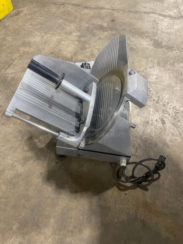Celme commercial electric deli meat slicer, stainless steel, countertop design, integrated sharpener, power cord attached.