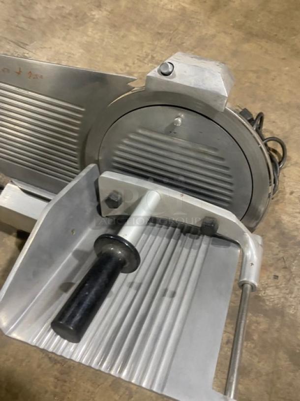 Celme commercial electric deli meat slicer, gray metal, countertop design, visible slicing blade, clean condition.