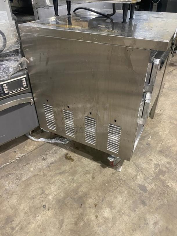 Leader LB36SC stainless steel refrigerated worktop, 1-1/2 door, poly-coated wired rack, on casters, 115V, used condition.