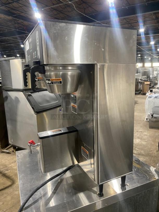 Bunn ThermoFresh DUALTFDBC commercial stainless steel dual coffee brewer with hot water dispenser, digital controls, on legs.