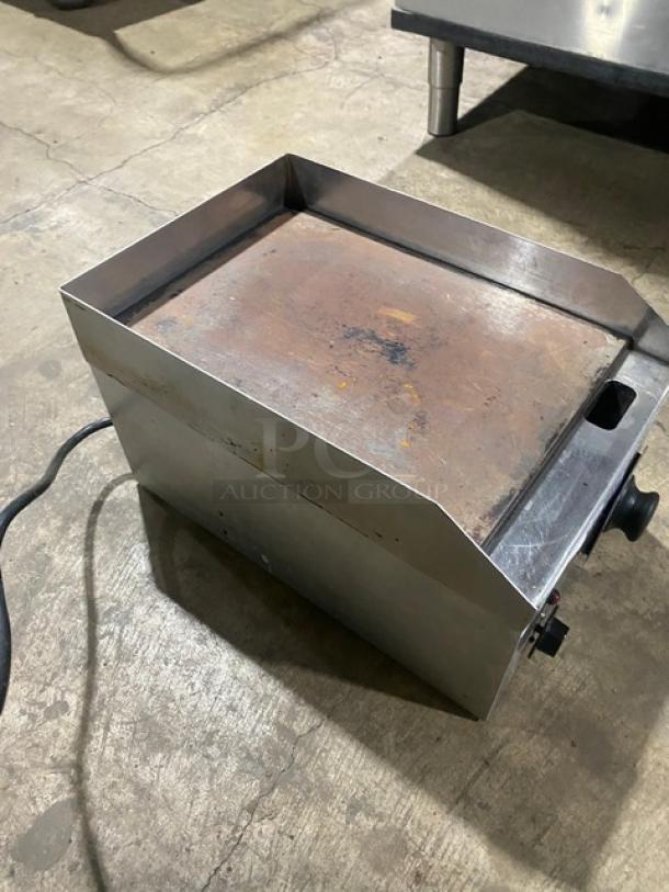Diamond stainless steel electric countertop griddle with back and side splash, used condition, cord attached.