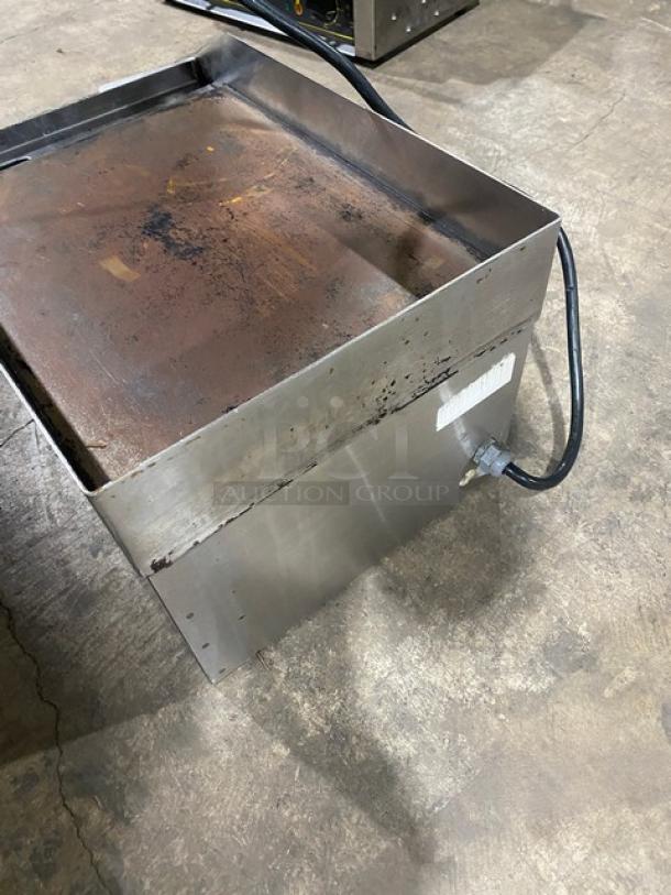 Diamond Commercial stainless steel electric countertop flat griddle with back and side splash. Shows signs of use.