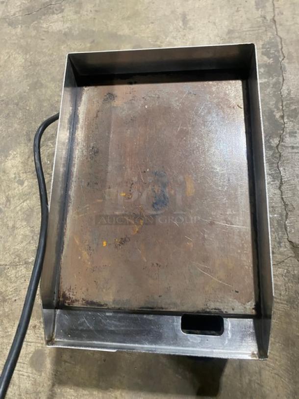 Diamond stainless steel electric countertop griddle with back and side splash, used condition, visible wear marks.