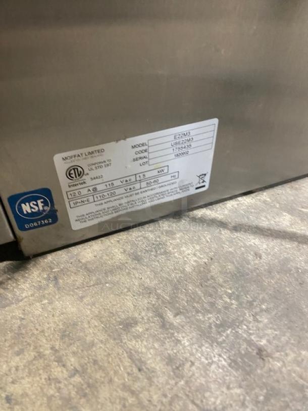 Moffat Turbofan E22M3 stainless steel convection oven, 115V, with wired rack. Model and serial number shown on label.
