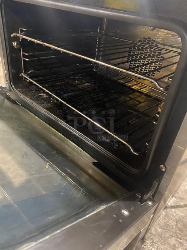 Moffat Turbofan E22M3 stainless steel countertop convection oven, includes wired oven rack, shows interior condition.