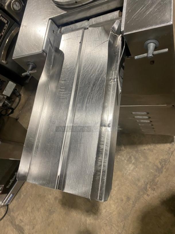 Atwood Scale-O-Matic S300 stainless steel dough divider/rounder with conveyor outfeed, electric powered, on casters.