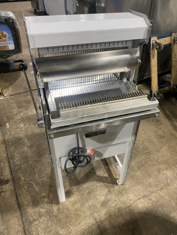 Oliver Safety-Slicer electric bread slicing machine with stainless steel worktop, SN: 86430, on legs, in good condition.