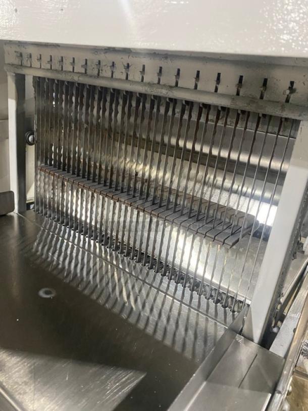 Oliver Safety-Slicer commercial bread slicer with stainless steel worktop, SN: 86430, on legs, electric powered, white.
