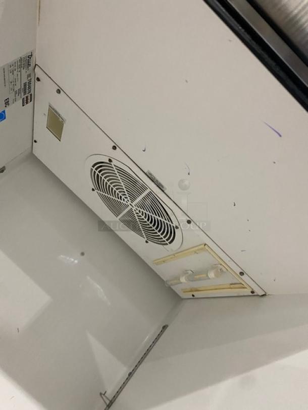 True TG1R-1S commercial stainless steel refrigerator, Energy Star certified, with poly-coated wired rack, interior fan visible, on casters.