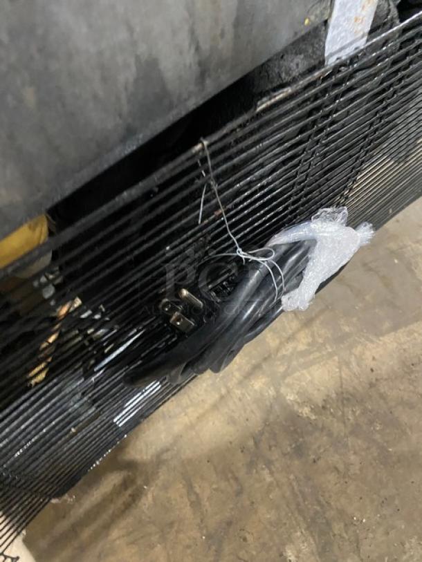 Atosa MCF8701 commercial freezer behind view, showing electrical cord coiled and secured with zip tie.